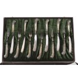 TWELVE PIECES OF SILVER FISH CUTLERY, Punch SHEFFIELD 1921 with blades in silver-plated metal and