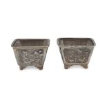 A PAIR OF SILVER SALTCELLARS, PUNCH HONG KONG, 1854/1930 body chiseled to flowers, inside bowls in