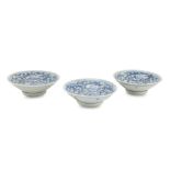 THREE WHITE AND BLUE PORCELAIN SAUCERS, CHINA 19TH CENTURY decorated with peonies and floral