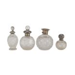 FOUR PERFUME BOTTLES IN CRYSTAL GLASS AND SILVER, PUNCH BIRMINGHAM EARLY 20TH CENTURY body cut to