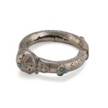 A SILVER BANGLE, PROBABLY INDIA 19TH CENTURY with dome clasp, with turquoise insert. Title 800/1000.