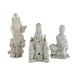 THREE WHITE PORCELAIN SCULPTURES, CHINA FIRST HALF OF 20TH CENTURY representing Guanyin with orderly