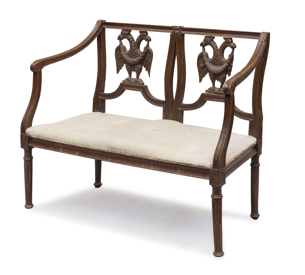 MIGNON SOFA IN WALNUT, END 18TH CENTURY back pierced to double eagles with garland. Shaped arms,