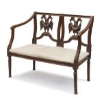 MIGNON SOFA IN WALNUT, END 18TH CENTURY back pierced to double eagles with garland. Shaped arms,