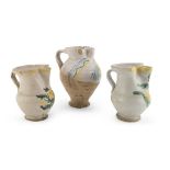 THREE PITCHERS IN EARTHENWARE, SOUTHERN ITALY, 19TH CENTURY in white and polychrome enamel,