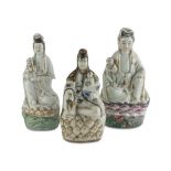 THREE SCULPTURES IN PORCELAIN AND CERAMICS, CHINA 20TH CENTURY representing Guanyin on a big
