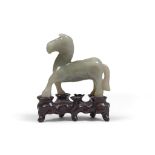 Jade sculpture, China 20TH CENTURY representing a horse to the trot. Base in wood shaped. Measures