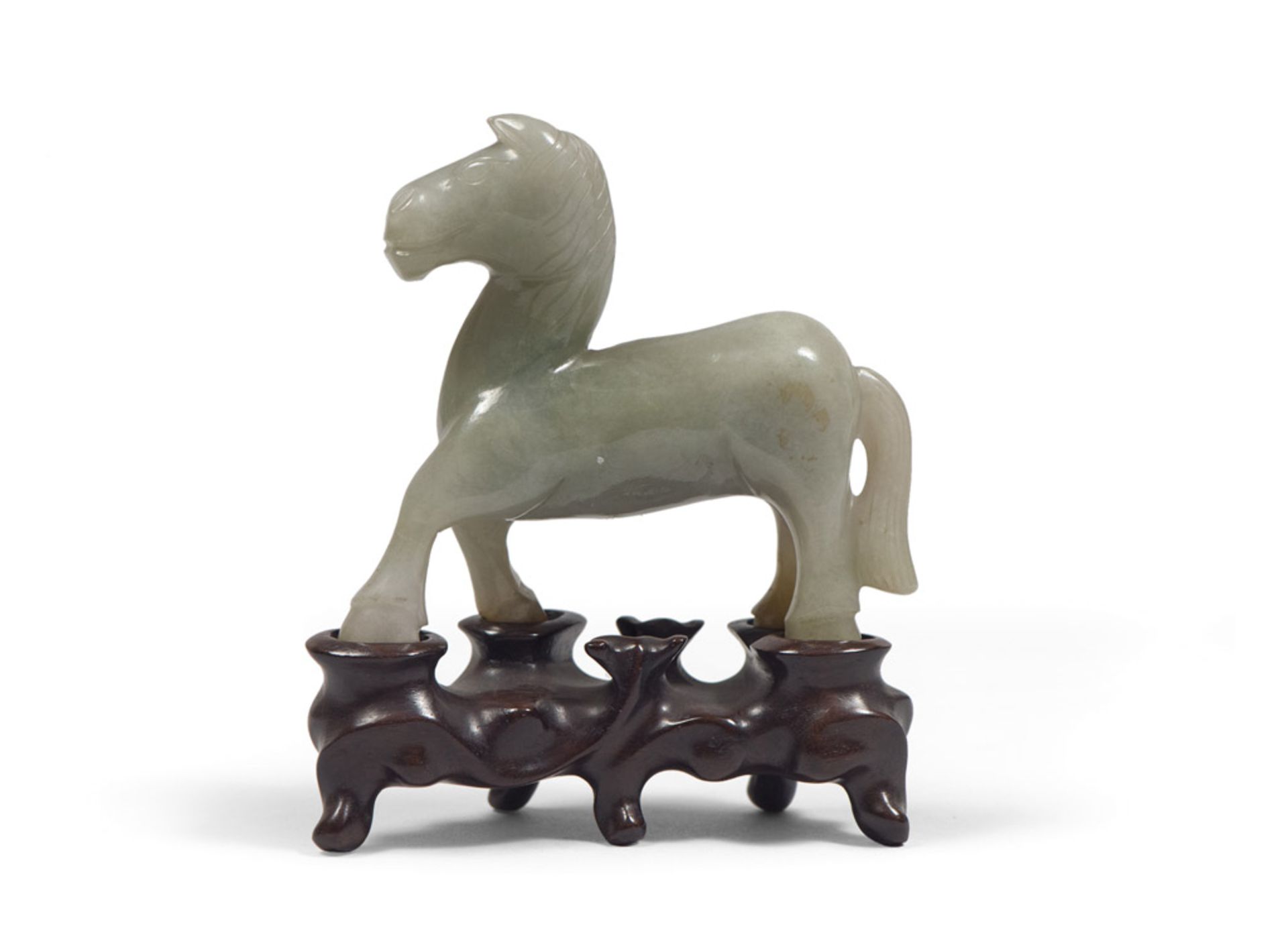 Jade sculpture, China 20TH CENTURY representing a horse to the trot. Base in wood shaped. Measures