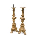A PAIR OF GILTWOOD CANDLESTICKS, PROBABLY VENICE 18TH CENTURY shaft and triangular base sculpted