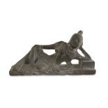 SCULPTURE IN SCHIST, CHINA 20TH CENTURY representing Guanyin reclining on a side. The divine