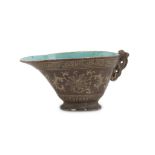 SMALL GRAVY BOAT IN PORCELAIN, CHINA EARLY 20TH CENTURY decorated with fantasies of lotus on brown
