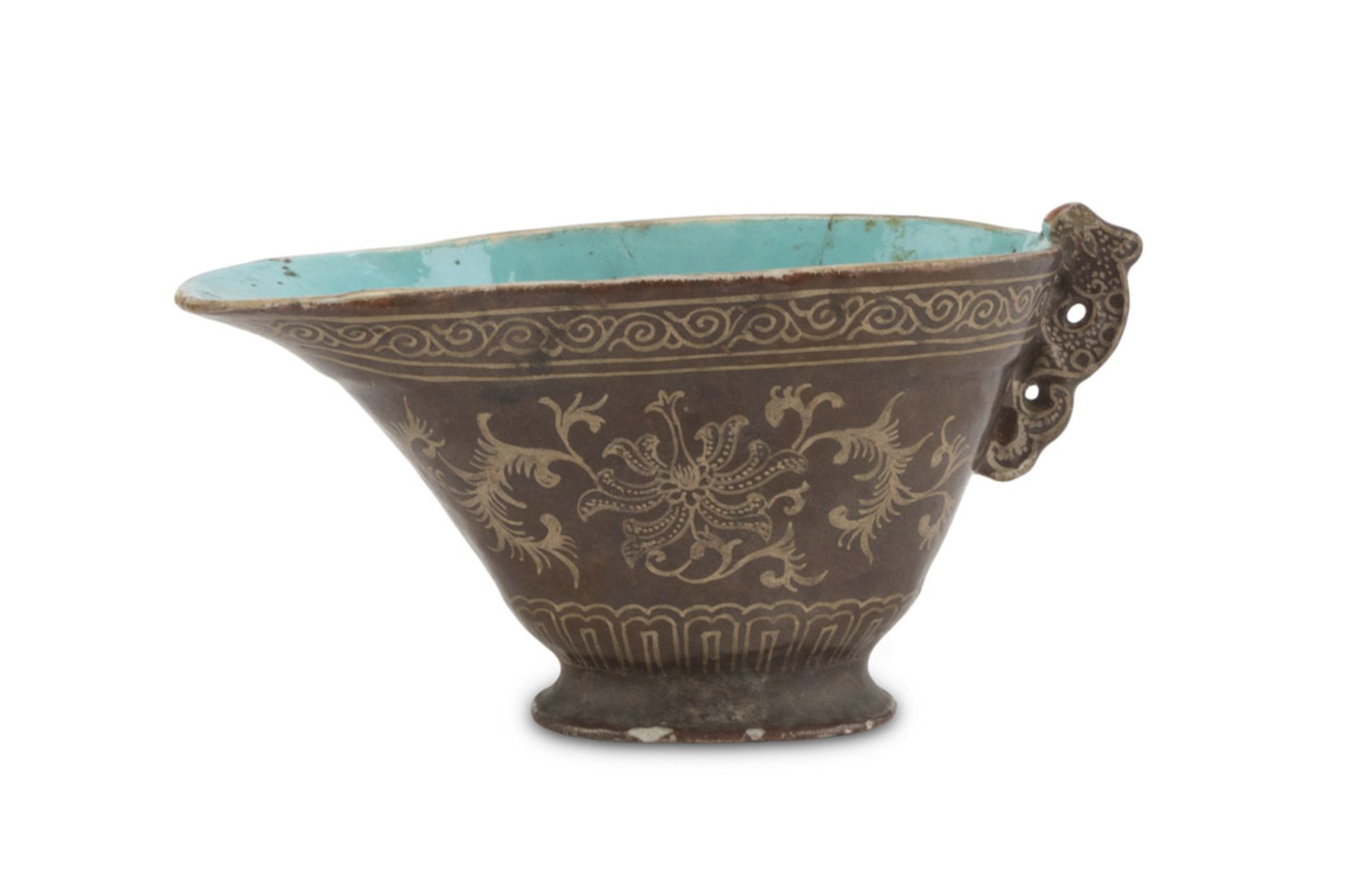 SMALL GRAVY BOAT IN PORCELAIN, CHINA EARLY 20TH CENTURY decorated with fantasies of lotus on brown