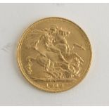 A PAIR OF GOLD POUNDS, UNITED KINGDOM GEORGE V with bas-reliefs of profile and riders. Measures