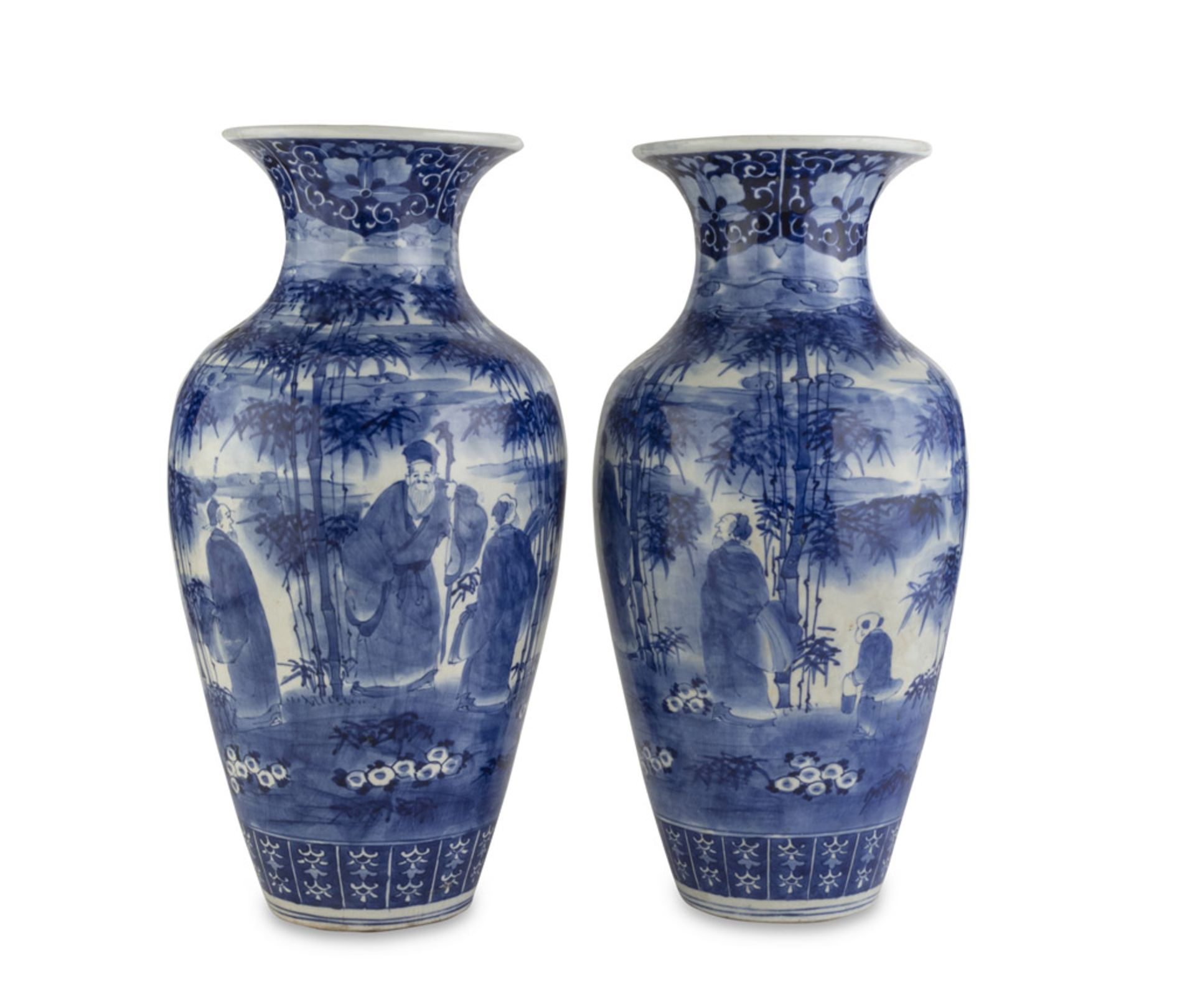 A PAIR OF WHITE AND BLUE PORCELAIN VASES, JAPAN LATE 19TH, EARLY 20TH CENTURY decorated with a