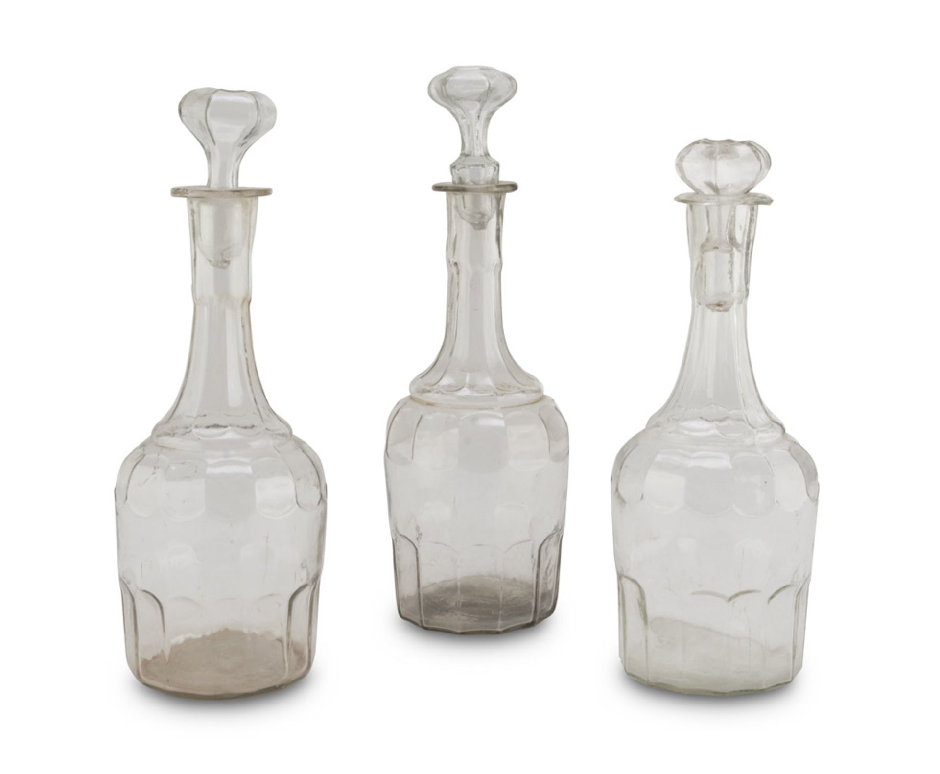 THREE BOTTLES IN BLOWN GLASS, 19TH CENTURY Maximum size cm. 35 x 13. TRE BOTTIGLIE IN VETRO