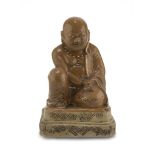 SCULPTURE IN BROWN CERAMICS, CHINA 20TH CENTURY representing Budai wearing a rosary. Measures cm. 28