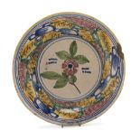 CERAMIC DISH, SOUTHERN ITALY, 19TH CENTURY in polychromy, decorated with flower and abstract