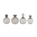 Four Perfume bottles In GLASS AND SILVER, Punch London, EARLY 20TH CENTURY with bodies cut to