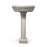 HOLY WATER STOUP IN PEPERINO, LATE 19TH CENTURY with column, of fifteenth-century taste. Basin