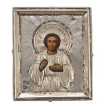 RUSSIAN PAINTER, EARLY 20TH CENTURY ST. JOHN Small icon in oil on panel, cm. 5 x 4 Riza in silver,