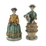 TWO SCULPTURES IN CERAMICS, PROBABLY CALTAGIRONE, 19TH CENTURY in use as candlesticks, shaped to