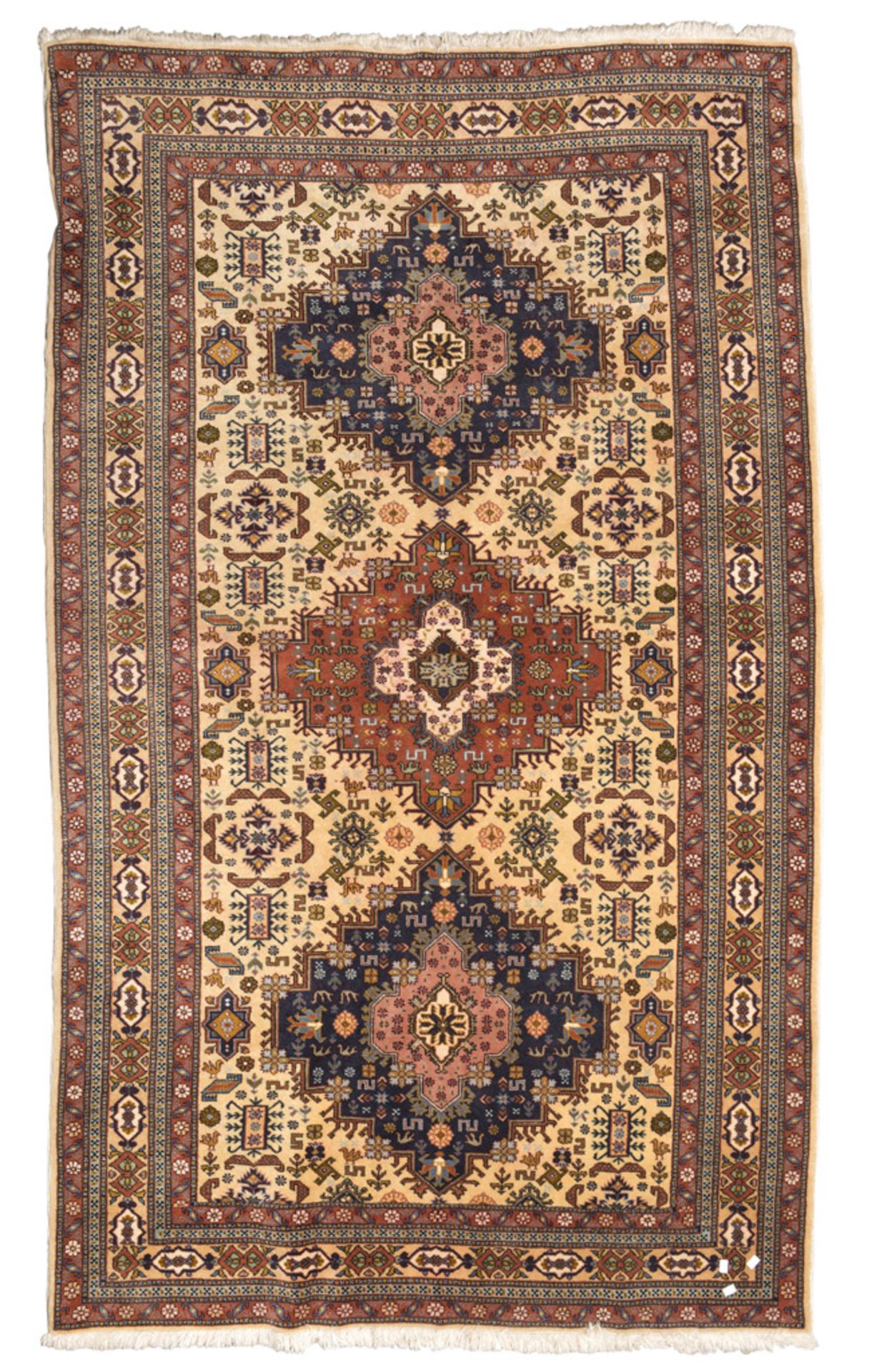 PAKISTAN CARPET, MID-20TH CENTURY triple jagged medallion, with secondary motifs of claws,