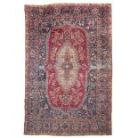 SPLENDID KIRMAN CARPET, EARLY 20TH CENTURY big medallion with branches of leaves and shield and