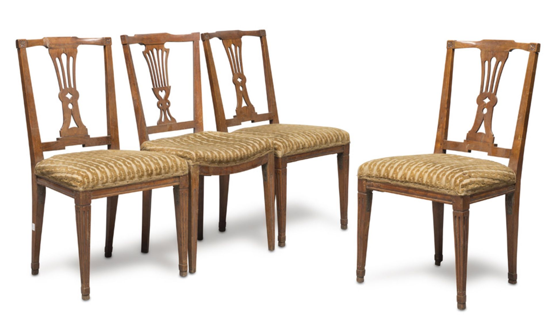 FOUR WALNUT CHAIRS, CENTRAL ITALY LATE 19TH CENTURY with pierced lyre backs to and fluted obelisk