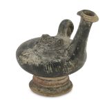 BLACK VARNISHED APULIAN GUTTUS, 4TH CENTURY B.C. in yellowish clay, black varnish, band on the