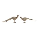 PAIR OF FIGURES OF PEACOCKS IN SILVER-PLATED METAL, 20TH CENTURY Measures cm. 6 x 3 x 12. COPPIA