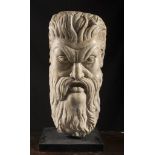 BIG MASK IN WHITE MARBLE, 17TH CENTURY representing a grotesque face, with beard and mighty hair.