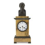 TABLE CLOCK IN YELLOW SIENA MARBLE, EMPIRE PERIOD with finishes in bronze and head of Demostene on