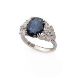 SPLENDID RING in white gold 18 kts., with central sapphire and side diamonds. Sapphire ct. 2.50,