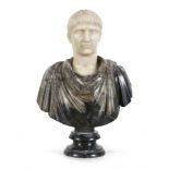 SMALL BUST OF CAESAR, 19TH CENTURY in white marble and African marble. Measures cm. 38 x 24 x 14.