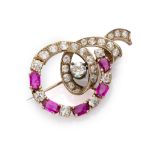 FANTASY BROOCH in white gold 18 kts., with antique cut diamonds Diamonds ct. 3.30 ca., rubies ct.