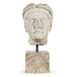 HEAD OF EMPEROR TIBERIUS IN WHITE STATUARY MARBLE, 18TH CENTURY with base in pink marble in