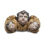 LACQUERED WOODEN FRIEZE, ROME 18TH CENTURY carved to three heads of cherubs with wings in gilt