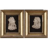 A PAIR OF MARBLE BAS-RELIEFS, 17TH CENTURY representing profiles of sovereigns. Giltwood frames.