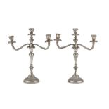 A PAIR OF SILVER CANDELABRA, PUNCH FLORENCE, 1944/1968 with arms to leafy ramages and fluted