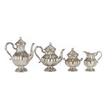 SILVER-PLATED TEA SERVICE, 19TH CENTURY with fluted elements. Consisting of teapot, coffeepot,