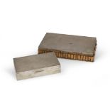 TWO CIGARETTE BOXES, 20TH CENTURY in wood and bamboo, covered with silver. Maximum size cm. 4,5 x 23