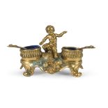 SMALL SALT CELLAR IN ORMOLU, LATE 19TH CENTURY two basins with blue glass and central figure of