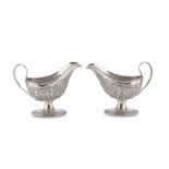 RARE PAIR OF SILVER GRAVY BOATS, PUNCH DUBLINO 1789 body entirely embossed with floral motifs.