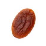 ANTIQUE OVAL CARNELIAN engraved with two stylized male figures. Measures cm. 3,2 x 18. weight gr.