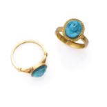 TWO RARE RINGS with mount in yellow gold 18 kts., with antique turquoises engraved with classical