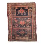 CAUCASIAN KARABAGH CARPET, EARLY 20TH CENTURY with triple abstract medallion within rectangular