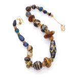 MAGNIFIQUE NECKLACE with elements in antique Faïance of different colors alternated by small pierced