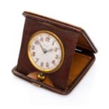 TRAVEL clock ASPREY, '50s in gilded metal, complete of leather box. Diameter cm. 6,6. Defects.