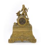 TABLE CLOCK IN ORMOLU, 19TH CENTURY with hunter's figure above the dial. Rectangular base chiseled