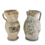 TWO PITCHERS IN MAIOLICA, APULIA 19TH CENTURY in white and cream enamel with polychrome floral